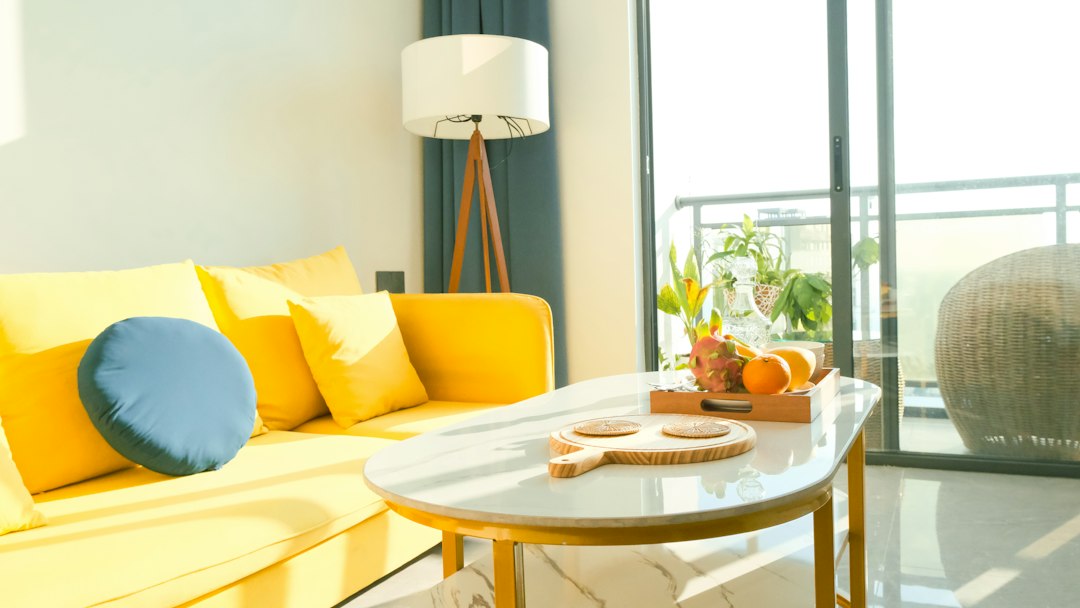 Living room cover showing how to choose a sofa with measuring tape, fabric swatches, and layout icons